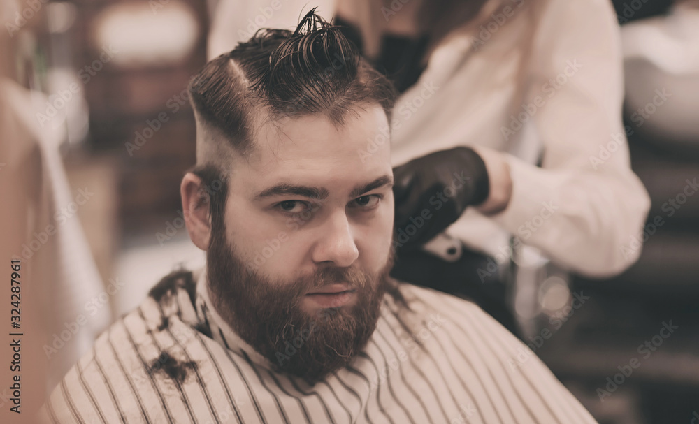 man in a barbershop. the concept of hairstyle and beauty man in a barbershop. the concept of hairstyle and beauty
