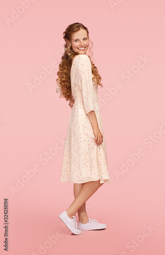 Happy young lady in summer dress
