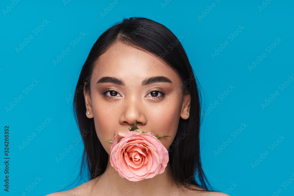 Pretty asian young woman with flower.
