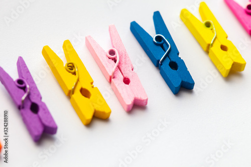 A row of wooden colorful clothespins