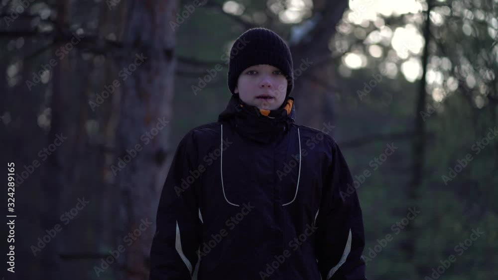 Portrait of teenager in a winter pine forest. Portrait of teenager in a winter pine forest.