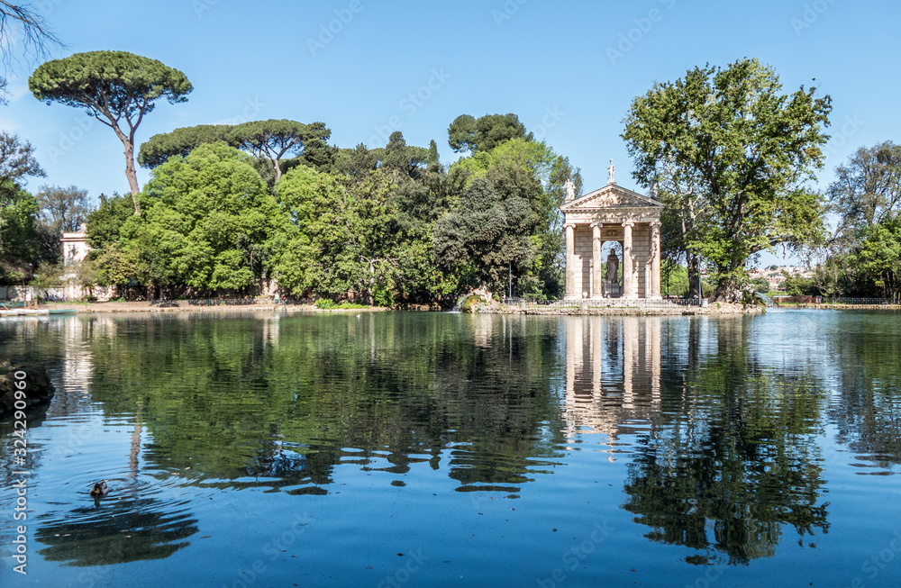 Villa Borghese pond with reflections on the water and fountains