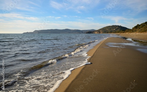 beach and sea during winter sunrset, in Tuscany