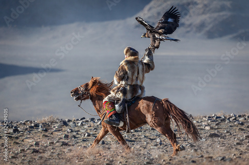 Kazakh berkut hunting western Mongolia Golden eagle festival horse riding photo