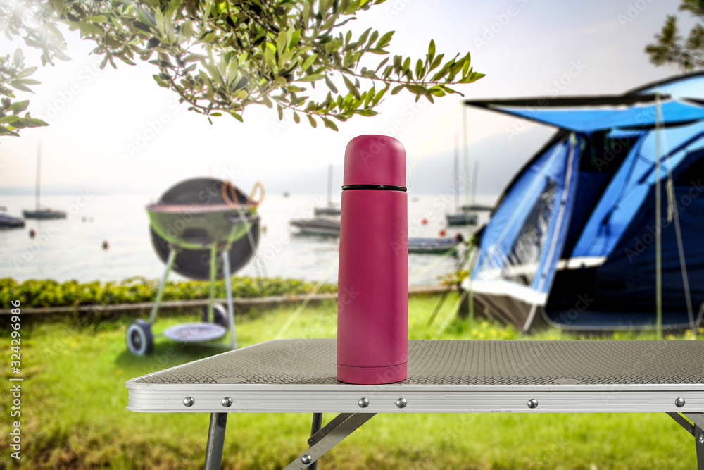 Metal table of free space for your decoration and camping blurred background. 