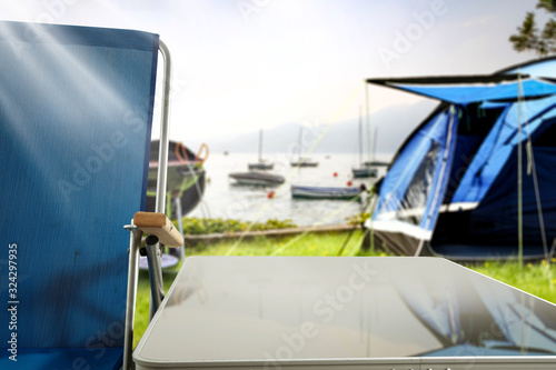 Metal table of free space for your decoration and camping blurred background. 