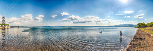 Photography View over lake Bracciano with swans and the afternoon light