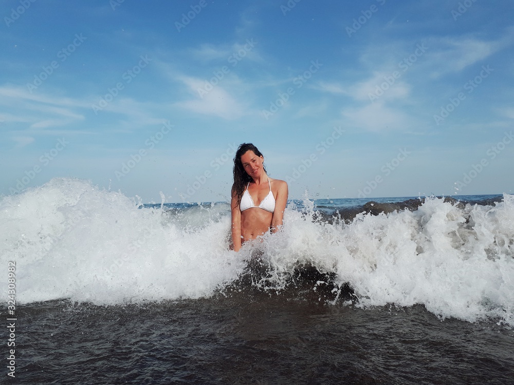 Woman inside a wave