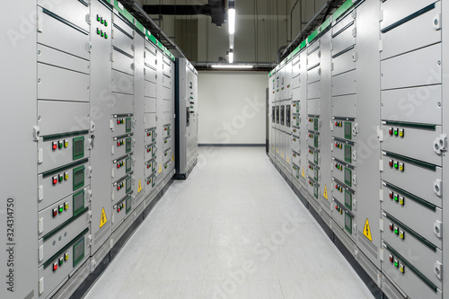 Low voltage switchboard. Electrical switch panel of switchgear room at power plant.