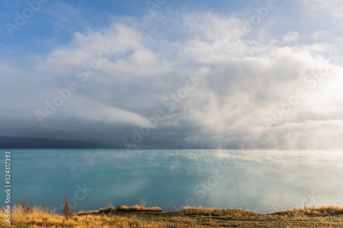 New Zealand, Oceania, South Island, Canterbury, Ben Ohau, Clouds over Lake Pukaki and Southern Alps (New Zealand Alps) photo