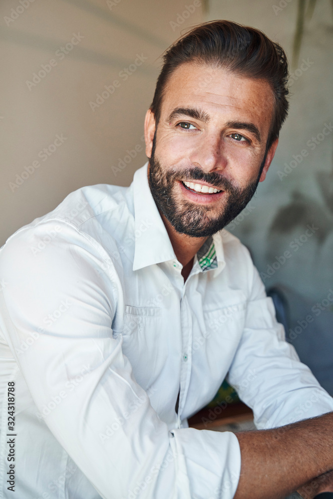 Portrait of smiling businessman wearing white shirt Portrait of smiling businessman wearing white shirt