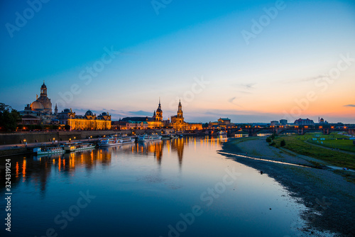 Germany, Saxony, Dresden, View of Academy of Fine Arts, Bruehl's Terrace, Sekundogenitur, Hausmann Tower, House of the Estates, Dresden Cathedral, Semper Opera House and Augustus bridge with Elbe waterfront in the evening
