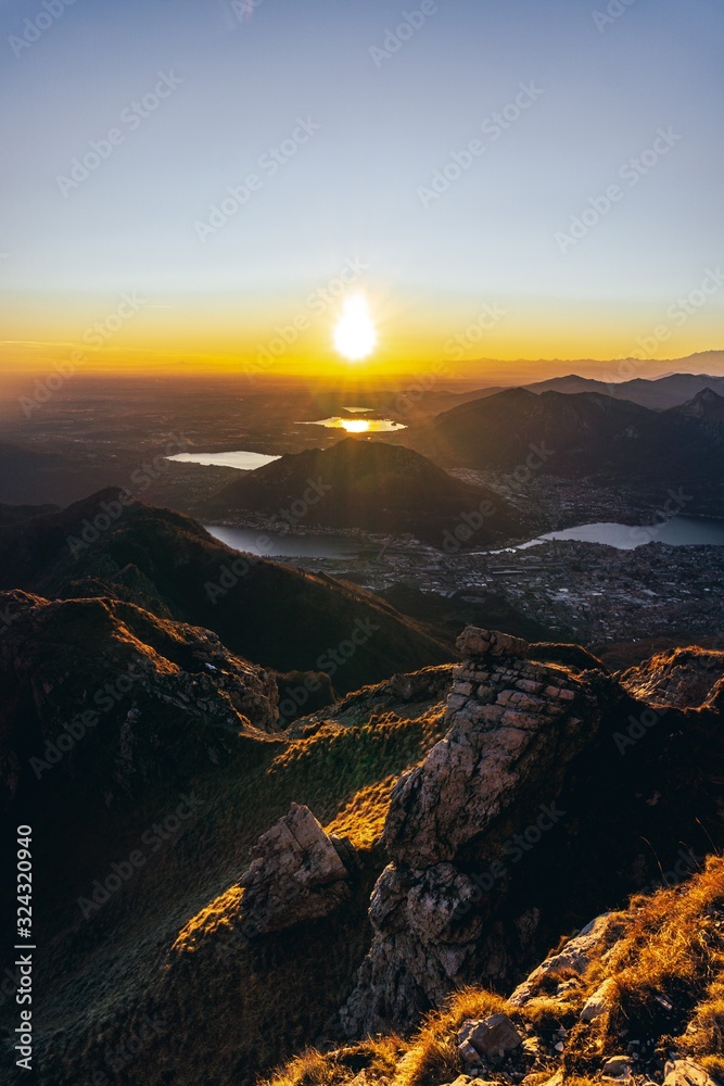 Sunset and landscape in the Orobie Alps during a fantastic cloudless day, near the town of Lecco, Italy - February 2019.
