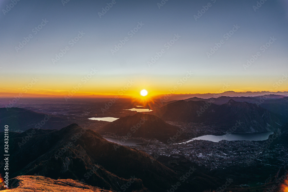 Sunset and landscape in the Orobie Alps during a fantastic cloudless day, near the town of Lecco, Italy - February 2019.
