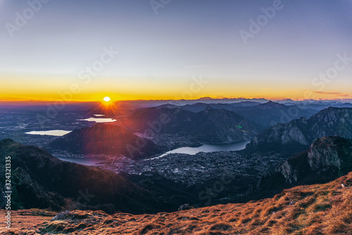 Sunset and landscape in the Orobie Alps during a fantastic cloudless day, near the town of Lecco, Italy - February 2019. photo