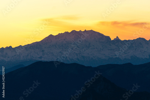 Monte Rosa, one of the highest peaks of the Alps, at sunset during a cloudless day, near the town of Lecco, Italy - February 2020.