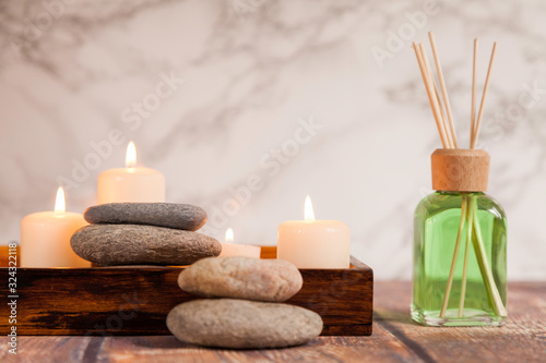 river pebbles on wooden box and air freshener