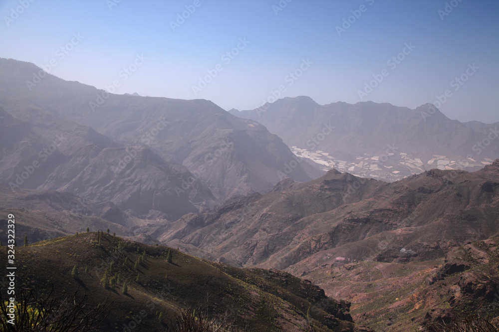 Gran Canaria, landscape around the least accessibal area in the west of the island, La Aldea de San Nicolas, thick layer of calima, Saharan dust, obstructing the view Gran Canaria, landscape around the least accessibal area in the west of the island, La Aldea de San Nicolas, thick layer of calima, Saharan dust, obstructing the view
