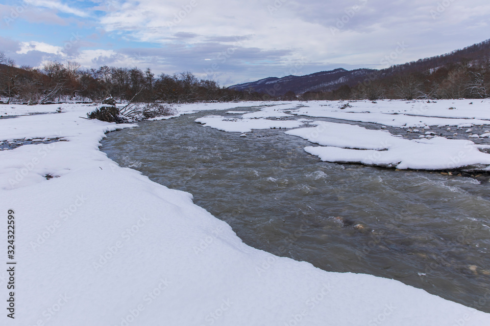 Fototapeta premium River passing through a mountain gorge in winter