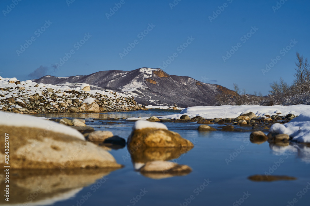 Fototapeta premium Nature landscape with mountains, snowy cliffs and river.