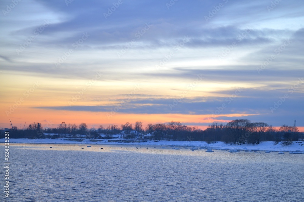 Winter Pink sunset and Urban Landscape view on a Baltic Sea Side. Sunset with snowy boulders and beach landscape. Baltic sea, winter Winter Pink sunset and Urban Landscape view on a Baltic Sea Side. Sunset with snowy boulders and beach landscape. Baltic sea, winter
