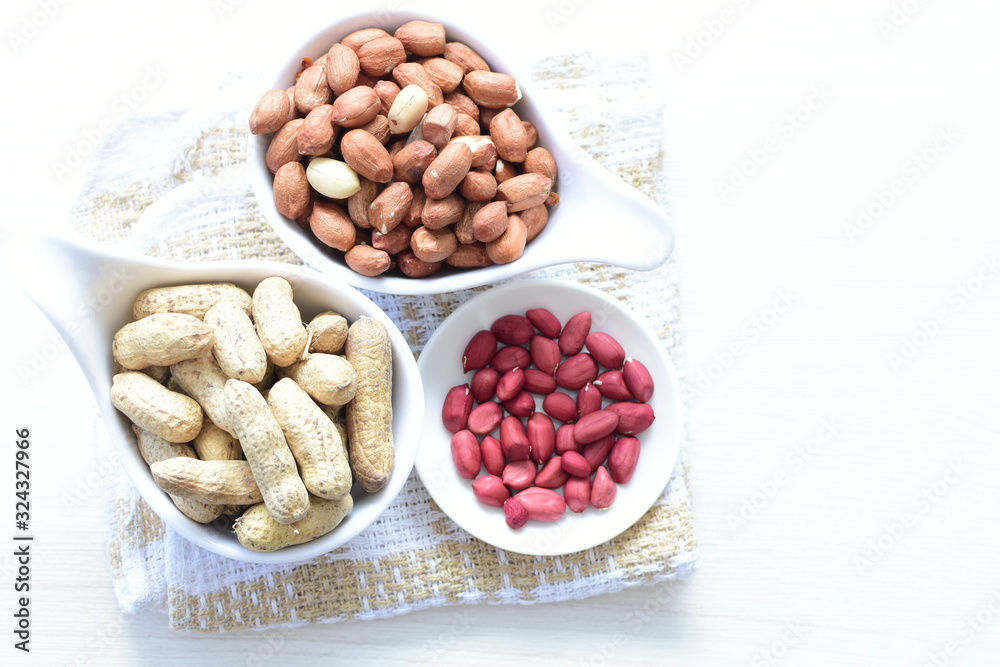 Dried peanuts (Arachis hypogaea) peanuts in shells, whole and chopped in containers Dried peanuts (Arachis hypogaea) peanuts in shells, whole and chopped in containers