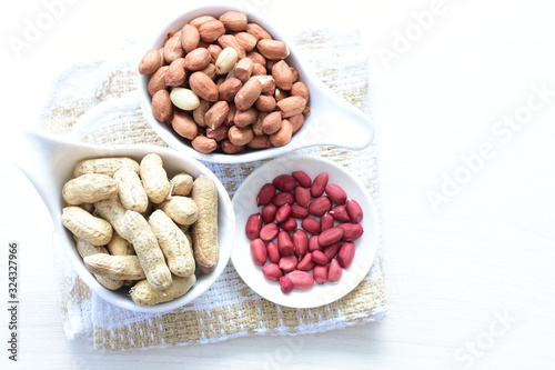 Dried peanuts (Arachis hypogaea) peanuts in shells, whole and chopped in containers