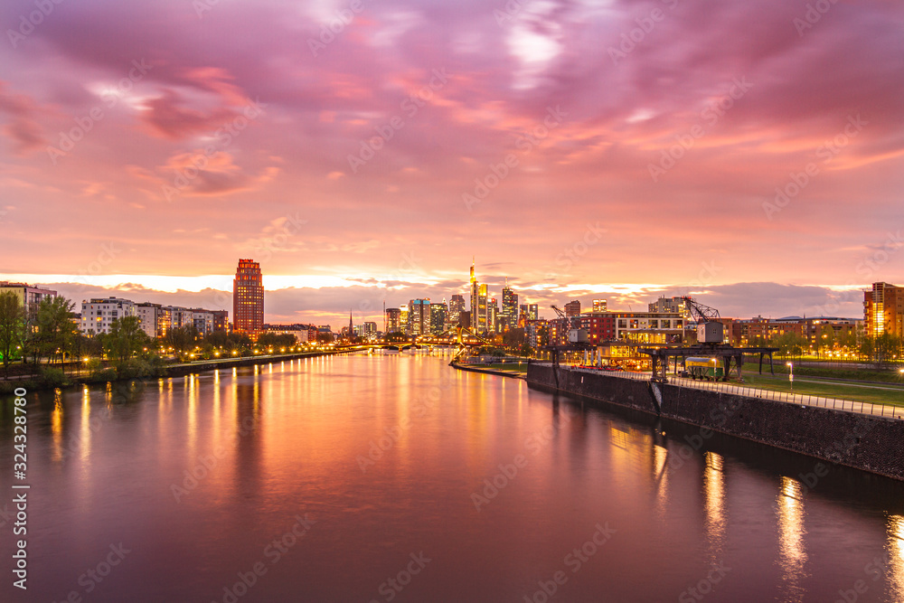 Colorful sunset over Frankfurt Skyline and main river