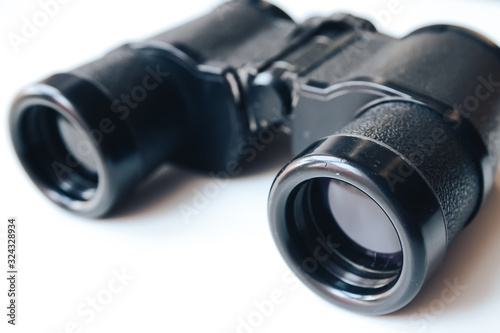 old black binoculars on white background