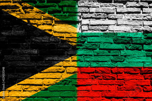 Flag of Jamaica and Bulgaria on brick wall