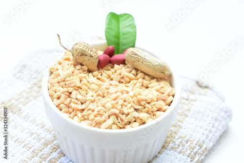 (Arachis hypogaea) chopped peanuts in containers