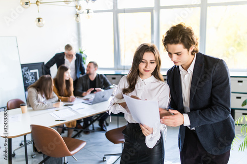 Business people analyzing financial data at the meeting desk