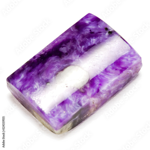 Charoite gemstone rectangle cabochon isolated on white background photo