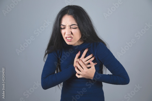 woman hand in ache heart