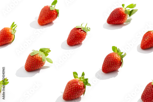Creative trendy pattern with fresh strawberry on white