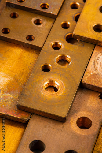 Copper bus bar with holes energy industry component close-up photo