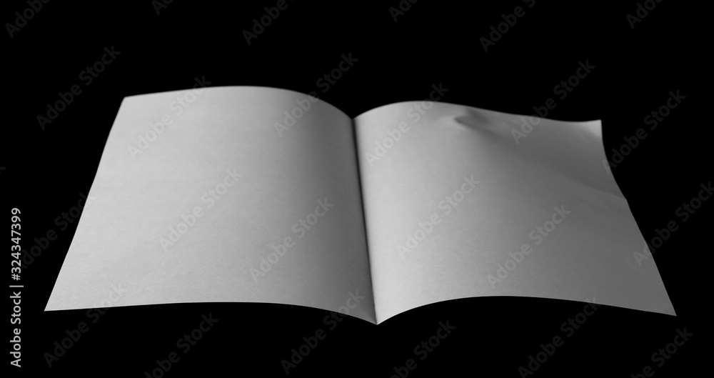 Fototapeta premium White paper for writing and printing isolated on black background 
