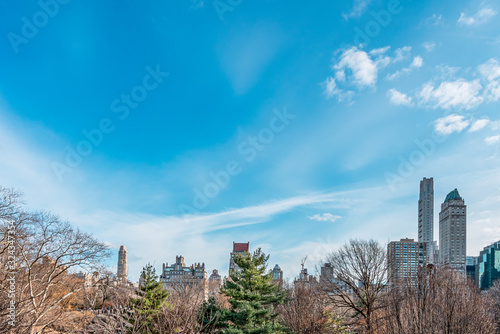 New York City, NY, USA - 25th, December, 2018 - Beautiful Architecture Skyline Buildings view in a cold sunny day in Central Park. © MontenegroStock