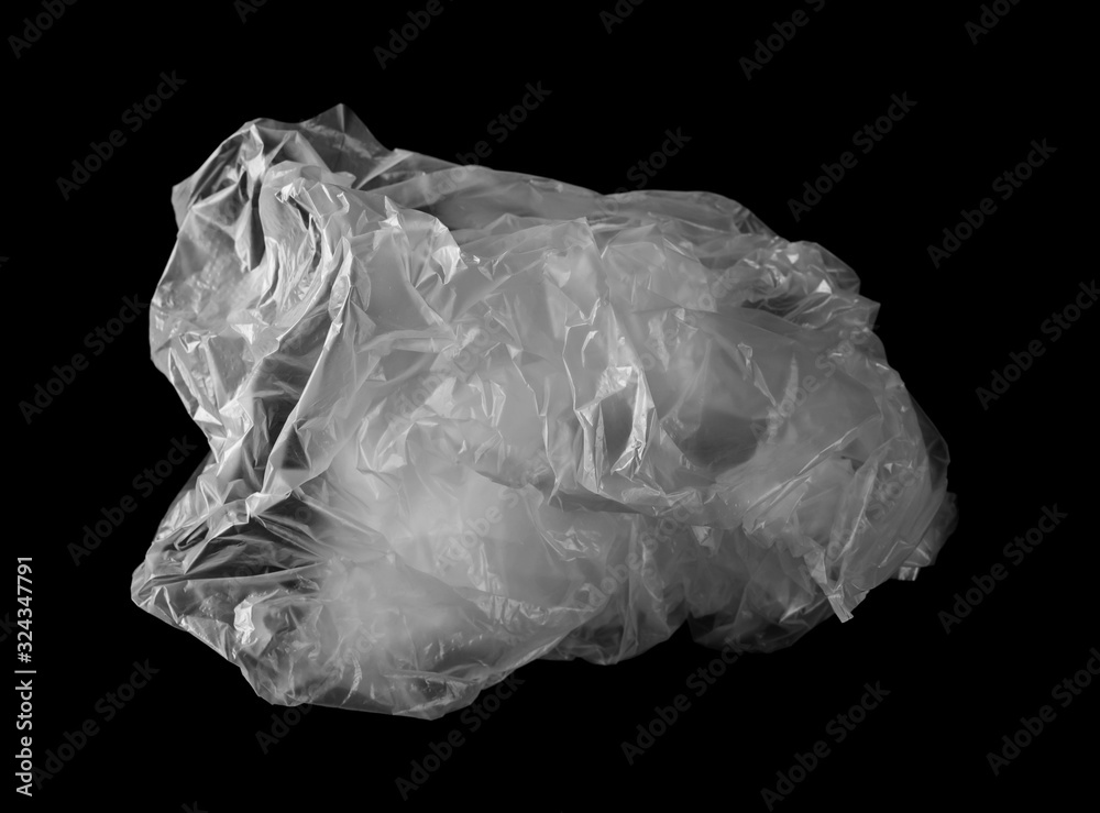 Crumpled white plastic bag isolated on black background Crumpled white plastic bag isolated on black background