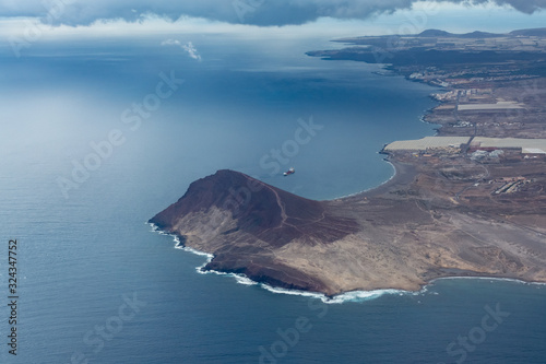 Aerial overcloud view on Tenerife island from airplane