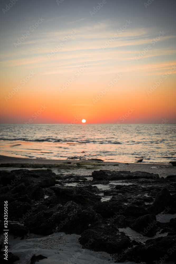 Sunset on a beach in Masirah Island, Oman