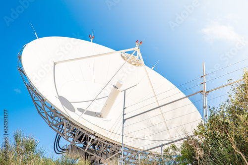 satellite antenna for receiving and transmitting information in electromagnetic waves via satellites in orbit photo