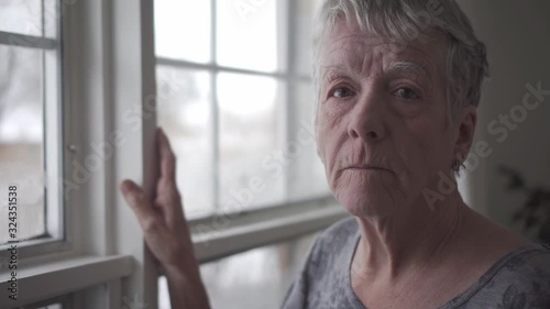 A sad lonely 70 years old senior in is apartment