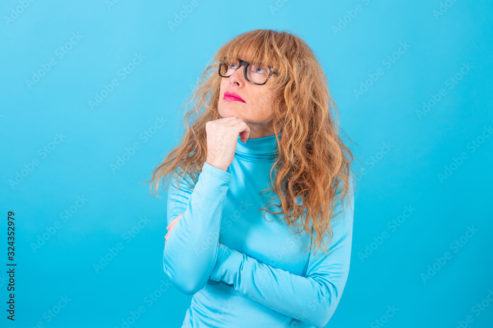 adult or senior woman isolated on blue background adult or senior woman isolated on blue background