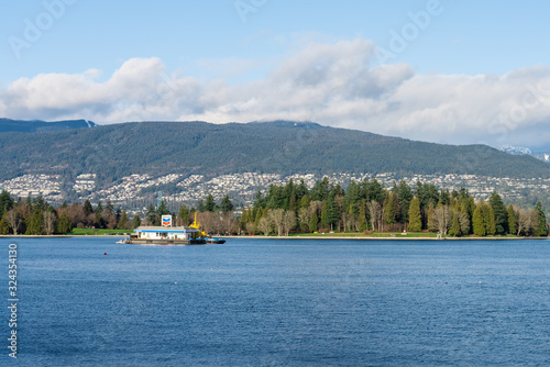 Vancouver, British Columbia, Canada - December, 2019 - Mountain View with clouds in a Beautiful blue sky day. © MontenegroStock