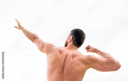 Bodybuilder strong muscular back feeling powerful and superior. Achieve success. Successful athlete. Victory and success. Champion and winner concept. Sport motivation. Man celebrating success