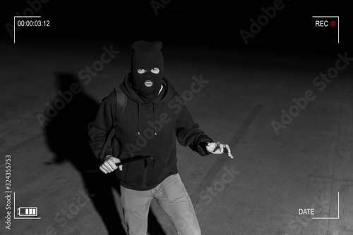 CCTV View Of Thief Standing In Dark Alley