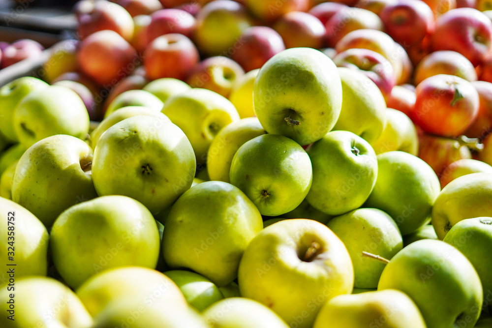 Green and red apples at the farmer's market Green and red apples at the farmer's market