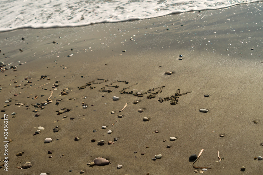 Word Relax on beach sand Word Relax on beach sand