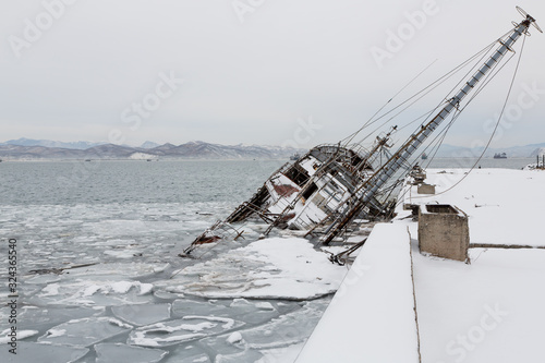 An old fishing vessel sank at pier